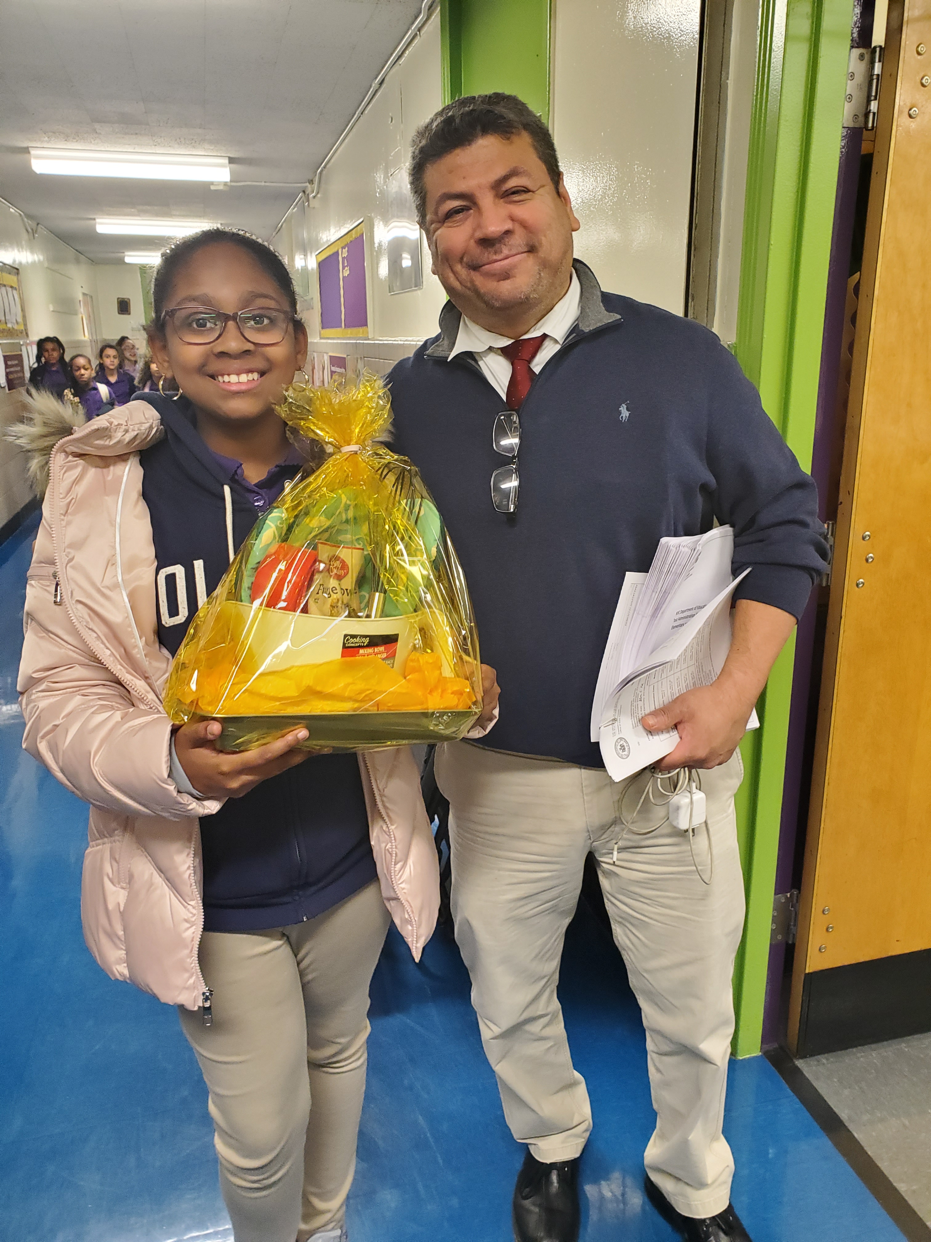 Student holding basket from Thanksgiving